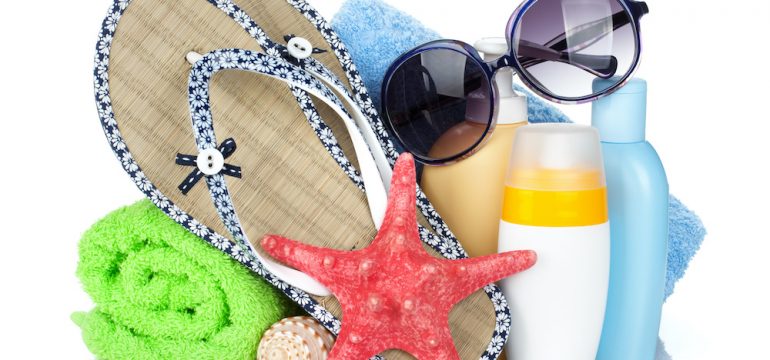 Beach items isolated on white background. Items that are July's best buys for shoppers.