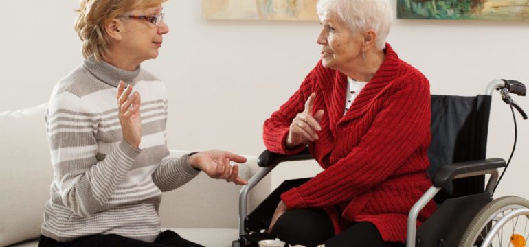 Two elder women home sharing a living space.