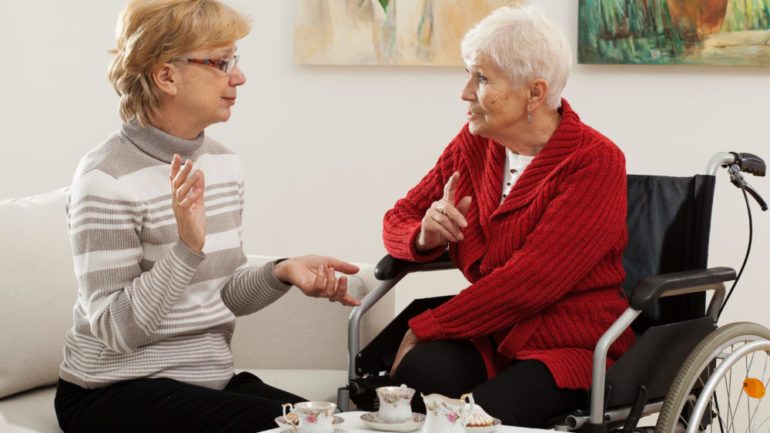 Two elder women home sharing a living space.