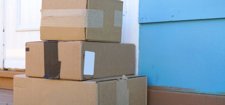 Delivered parcels showing danger of package theft from a front porch.