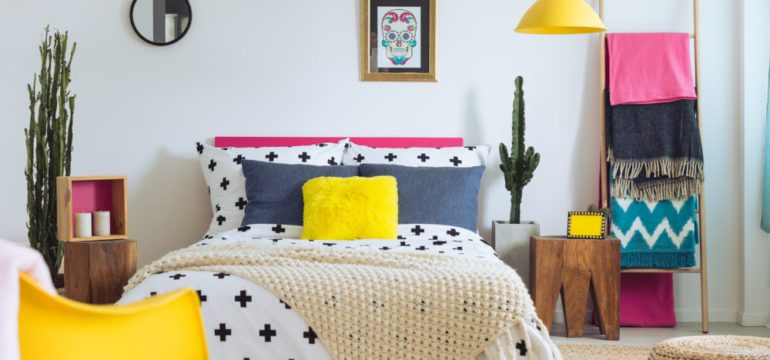 Festive bedroom of folk lover, mix of decorating trends, styles and materials.
