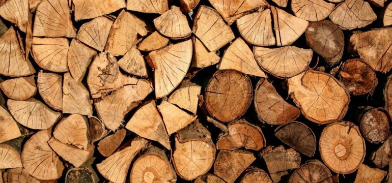 Chopped firewood in a stack. Firewood prepared for heating the home during winter.