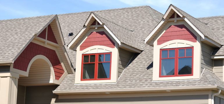 Gable dormers and roof of residential home.